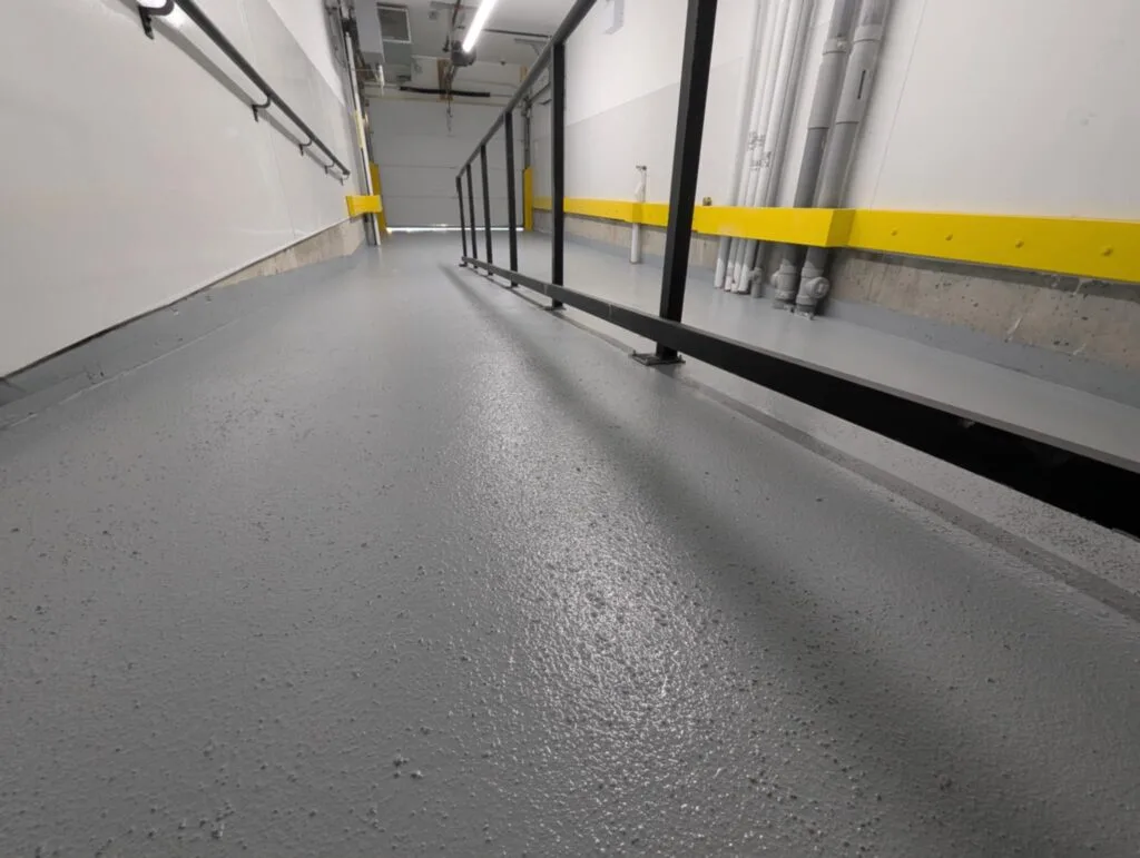 Anti-slip flooring in Calgary industrial facility for foot and vehicular traffic.