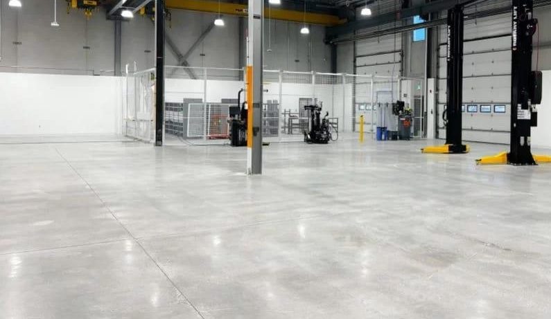 Polished concrete flooring by Concrete Inspirations for industrial warehouse spaces